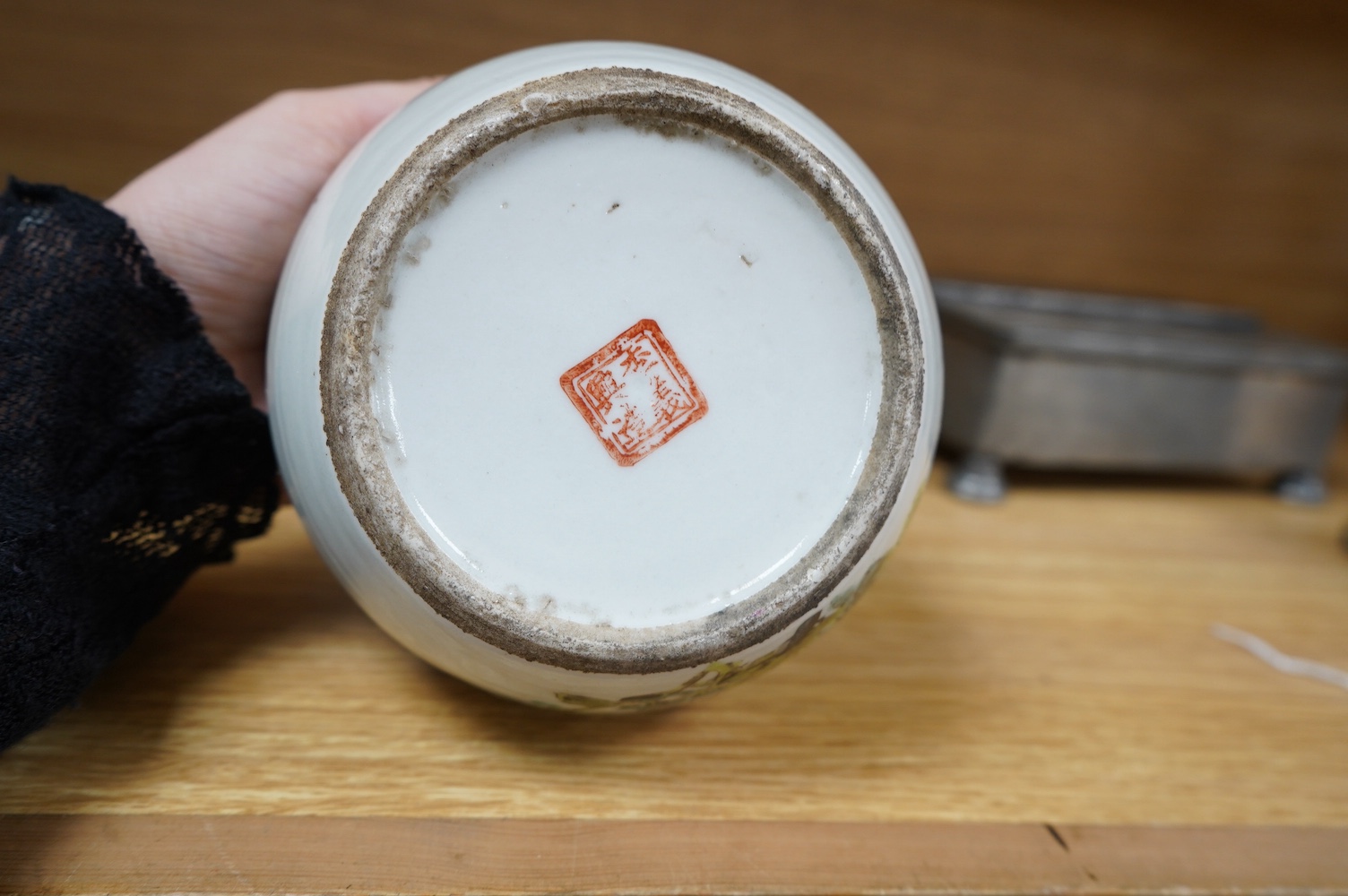 Three pieces of Chinese blue and white porcelain, including a double lipped sauceboat, 8.5cm high, and a famille rose lidded pot. Condition - fair